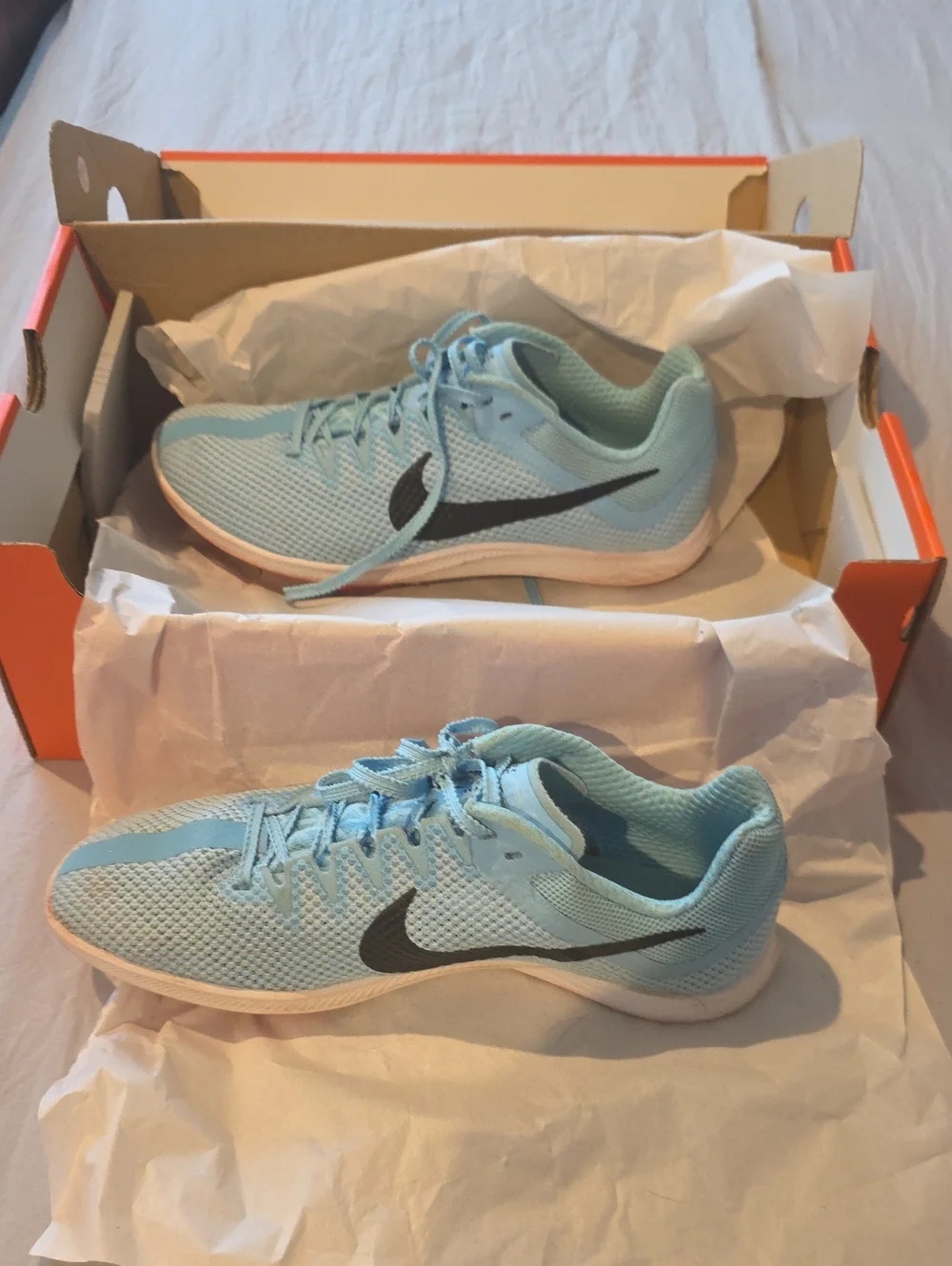 Nike Women's Light Blue Mesh Running Shoes with Black Swoosh